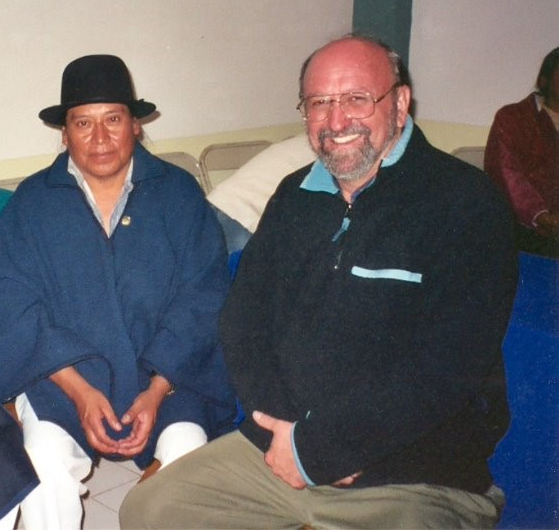 A group of people sitting on a couch</p>
<p>Description automatically generated
